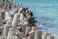 Detail shot of concrete tetrapod dolosse breakwater with steel eyes protecting the port of Hel, Poland from ocean tides Royalty Free Stock Photo