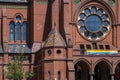 Detail shot of the entrance area and the facade of the Heilig-Kreuz-Church in Berlin Kreuzberg. A rainbow flag hangs over the entr Royalty Free Stock Photo