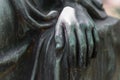 Detail shot of a female hand of a bronze statue of a woman in a park, Germany Royalty Free Stock Photo