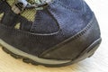 Detail shot of fragmrnt of new fashionable hiking mountain boot.