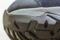 Detail shot of fragmrnt of new fashionable hiking mountain boot. Royalty Free Stock Photo