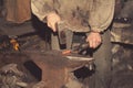 Detail shot of hammer forging hot iron at anvil Royalty Free Stock Photo