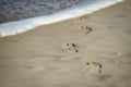 Man footprints in the sand on a beach Royalty Free Stock Photo