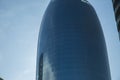 Detail shot of modern architecture facade,business concepts,in city of Azerbaijan. Clouds reflected in windows of modern office