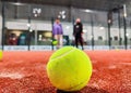 Detail shot of a paddle ball on the floor of the indoor paddle tennis