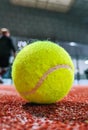 Detail shot of a paddle ball on the floor of the indoor paddle tennis