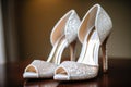 detail shot of a pair of brides glittering white heels