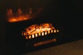 Detail shot of red-hot coals or wood in a cozy open fireplace Royalty Free Stock Photo