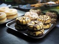 Sorted doughnuts in a bakery display