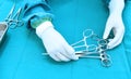 Detail shot of steralized surgery instruments with a hand grabbing a tool Royalty Free Stock Photo