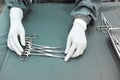 Detail shot of steralized surgery instruments with a hand grabbing a tool Royalty Free Stock Photo