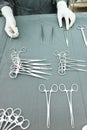 Detail shot of steralized surgery instruments with a hand grabbing a tool Royalty Free Stock Photo