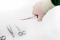 Detail shot of steralized surgery instruments with a hand grabbing a tool Royalty Free Stock Photo