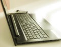 Detail side view of a laptop computer keyboard with the