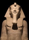 Detail of Egyptian Pharaoh Statue isolated on black background Royalty Free Stock Photo