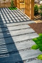 Detail of slate path with bark mulch and native plants in Japanese garden. Landscaping and gardening concept