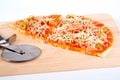 Detail of slices Italian pizza and cutter