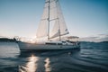 Detail of a small sailboat anchored in a bay