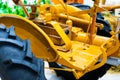 Detail of a small tractor with yellow construction tracks, Caterpillar Ten