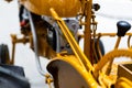 Detail of a small tractor with yellow construction tracks, Caterpillar Ten