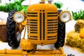 Detail of a small tractor with yellow construction tracks, Caterpillar Ten