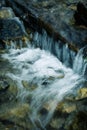 Detail small waterfall through the wood Royalty Free Stock Photo