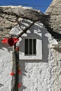 Detail of a small window of a trullo house in Alberobello, Apulia - Italy Royalty Free Stock Photo