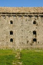 Detail of the small windows on a wall of an ancient castle Rozafa, Shkoder, Albania Royalty Free Stock Photo