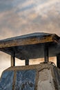 Detail of smoke coming out of the chimney of a pueblo house at sunset in a rural town Royalty Free Stock Photo