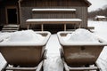 Detail of snow on an abandoned wheelbarrow