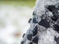 Detail of snow and ice imprinted in a thick winter tire tread on a fatbike Royalty Free Stock Photo