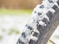 Detail of snow and ice imprinted in a thick winter tire tread on a fatbike Royalty Free Stock Photo