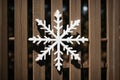 Detail of a snowflake on a wooden fence