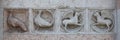 Detail of some marble medieval bas relief outside the Baptistery in Parma Royalty Free Stock Photo