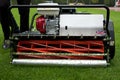 Spindle mower on the wet lawn Royalty Free Stock Photo