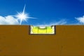 Detail of spirit level with blue sky Royalty Free Stock Photo