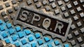 Detail of SPQR writing on the geometric cast iron manhole cover