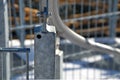 Detail of the stainless steel handrail mounting on the outdoor staircase of the terrace made of bent polished pipe. galvanized pri Royalty Free Stock Photo