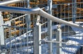 Detail of the stainless steel handrail mounting on the outdoor staircase of the terrace made of bent polished pipe. galvanized pri Royalty Free Stock Photo