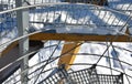 Detail of the stainless steel handrail mounting on the outdoor staircase of the terrace made of bent polished pipe. galvanized pri Royalty Free Stock Photo