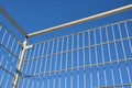 Detail of the stainless steel handrail mounting on the outdoor staircase of the terrace made of bent polished pipe. galvanized pri Royalty Free Stock Photo