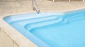 Detail stairs liner top view of swimming pool with blue water Royalty Free Stock Photo