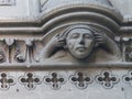 Face statue detail of the cathedral Notre-Dame of Bayeux in Normandy in France.