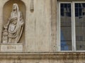 Detail of a statue of a philosopher next to the window at Palazzo Spada to Rome in Italy.