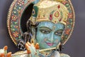 Detail of the statue Shiva, hindu idol on the temple in Rishikesh, India, closeup