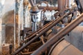 Detail of steam engine from 1903. Important part of technological line in historical factory. Metal cover of huge piston. Shabby,