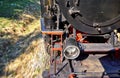 Detail of a steam locomotive while driving. Dynamics through motion blur Royalty Free Stock Photo