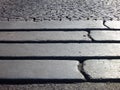 Detail of steps in a grey paved sidewalk