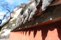 The detail of stone carving on the roof of asian monastery