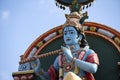 Detail stone statue in Sri Krishnan temple on south indian hindu temple in Singapore on blue sky background Royalty Free Stock Photo